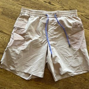Lululemon shorts mauve colored with purple draw string, pockets on the sides